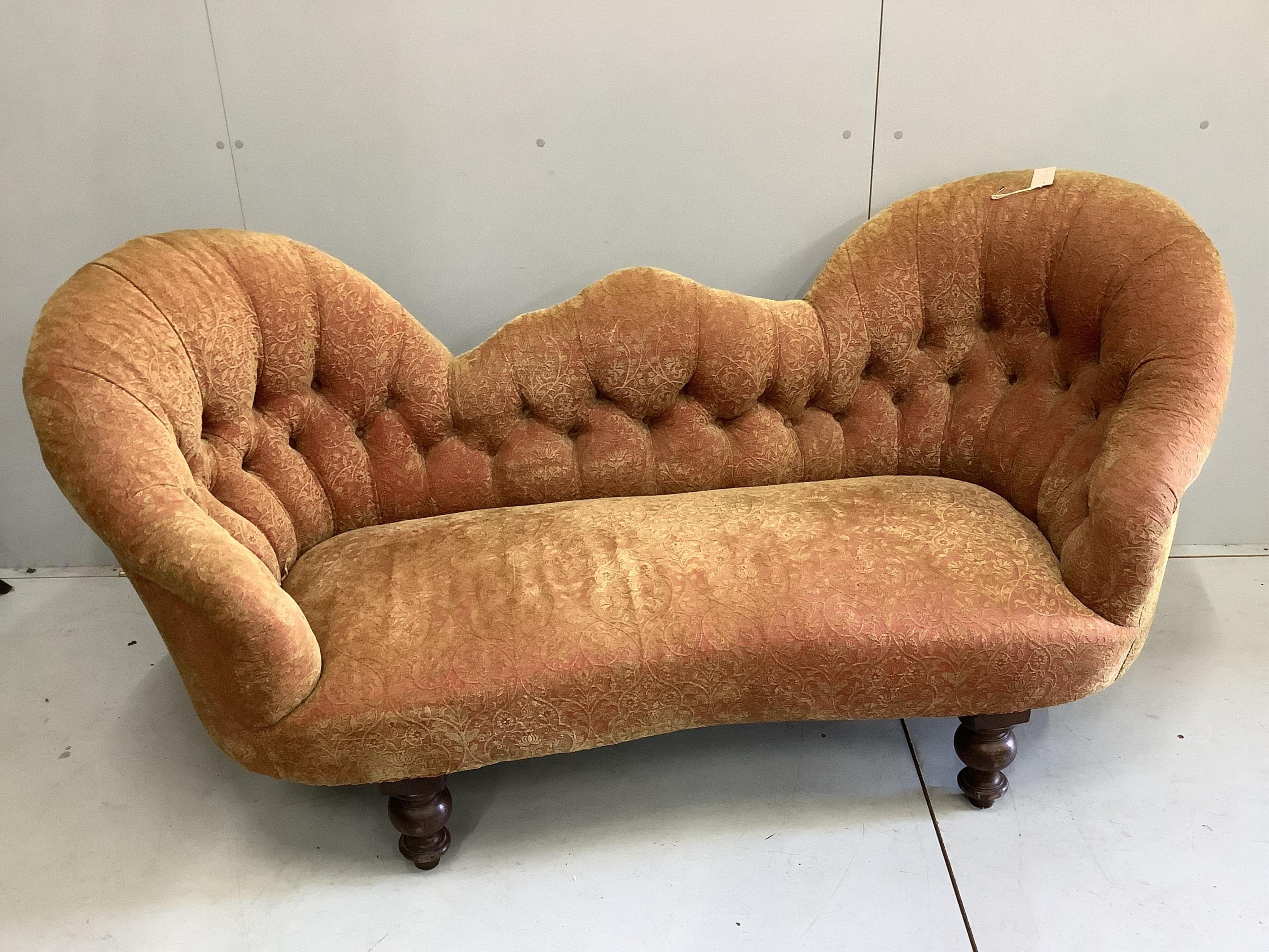 A Victorian double spoon back settee recently re-upholstered in buttoned patterned red and gold fabric, width 180cm, depth 72cm, height 83cm. Condition - good